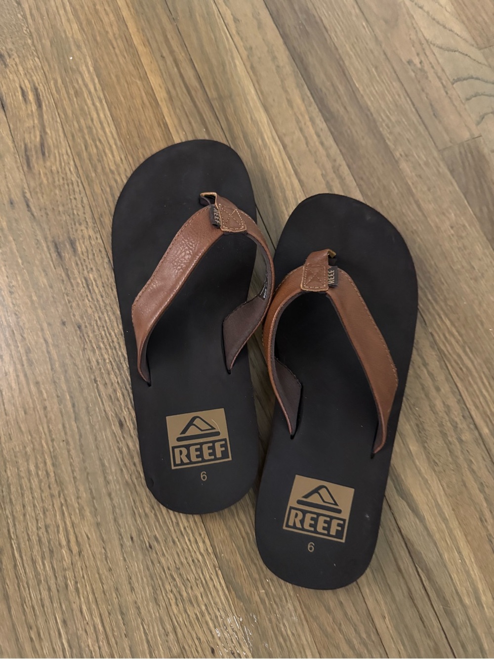 Reef Men's Brown Leather Strap Flip Flops with Black Footbed